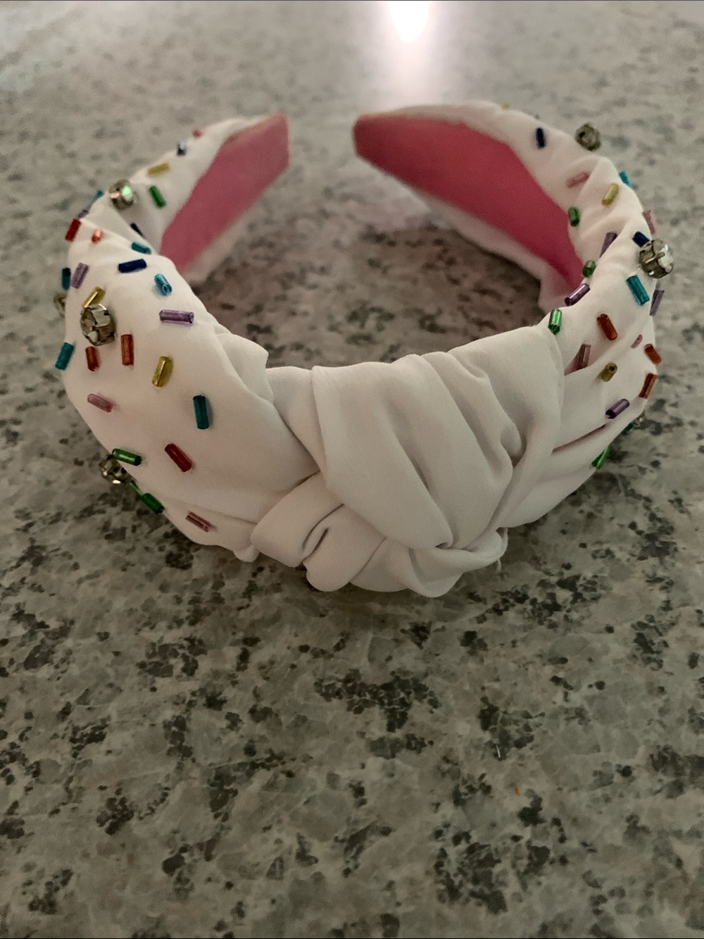 White celebration headband with “sprinkle” beads and gems